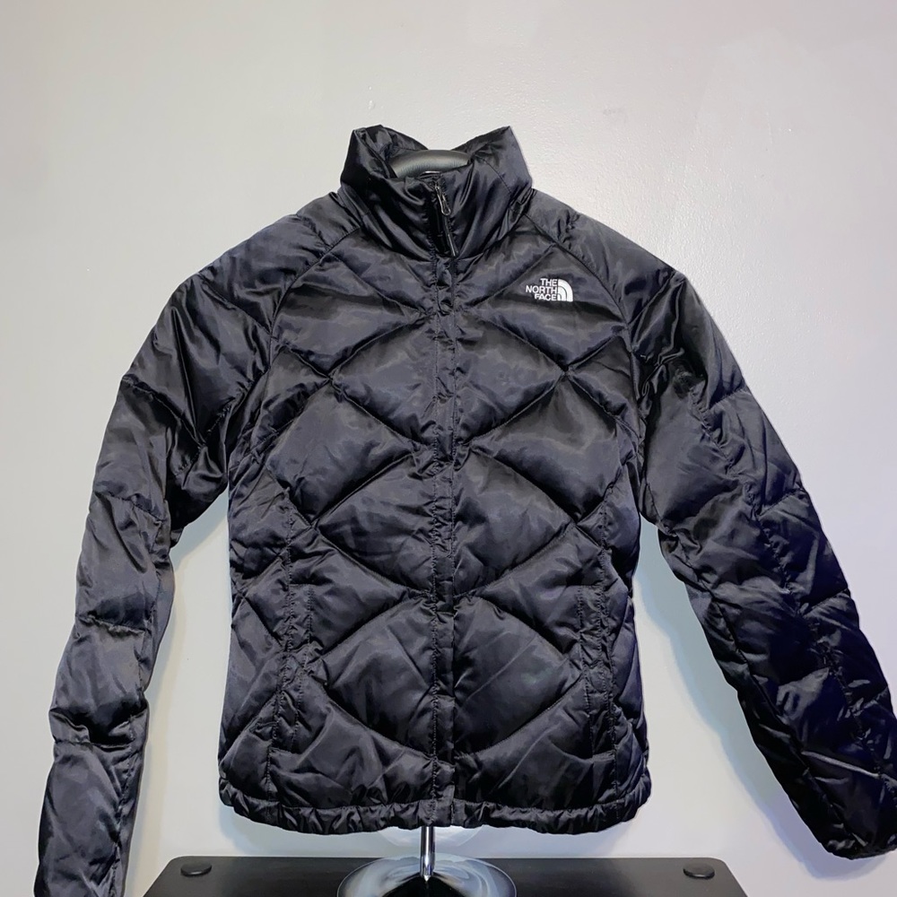 Woman’s North Face puffer jacket, black, size small.